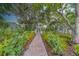 A brick walkway and well-manicured front yard lead to the home at 2412 Burlington N Ave, St Petersburg, FL 33713