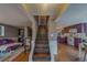 Interior view of entryway stairs connecting to the kitchen, living room and hardwood flooring at 2412 Burlington N Ave, St Petersburg, FL 33713