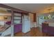 Well-lit kitchen featuring plum cabinets, modern appliances, and seamless flow to the living spaces at 2412 Burlington N Ave, St Petersburg, FL 33713