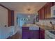 Charming kitchen with granite countertops, farmhouse sink, and stainless steel appliances at 2412 Burlington N Ave, St Petersburg, FL 33713