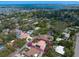 Aerial view showcasing a house nestled in a neighborhood near a body of water and a city at 307 Palmetto Ln, Largo, FL 33770