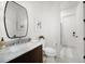 Bathroom features elegant vanity, marble countertop and walk-in shower at 307 Palmetto Ln, Largo, FL 33770