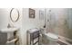 Bright bathroom features a unique vanity, frameless shower and elegant decor at 307 Palmetto Ln, Largo, FL 33770
