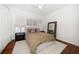 Bright bedroom boasts soft carpet, neutral decor, and ample closet space at 307 Palmetto Ln, Largo, FL 33770