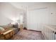 Cozy Bedroom features a crib and comfortable sofa; perfect for relaxation at 307 Palmetto Ln, Largo, FL 33770
