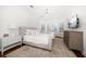 Light and bright bedroom with large windows, ceiling fan, and an area rug at 307 Palmetto Ln, Largo, FL 33770