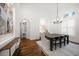 Dining area with shuttered window, hardwood floors, and decorative touches at 307 Palmetto Ln, Largo, FL 33770