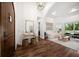 Elegant foyer with dark wood flooring and stylish decor leading into a cozy living room at 307 Palmetto Ln, Largo, FL 33770