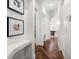 Hallway featuring hardwood floors and wall art at 307 Palmetto Ln, Largo, FL 33770