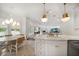 Modern kitchen with a center island, an adjacent breakfast nook, and a view of the living area at 307 Palmetto Ln, Largo, FL 33770
