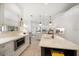 Bright, open kitchen with marble countertops, stainless steel appliances, and gold hardware at 307 Palmetto Ln, Largo, FL 33770