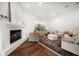 Comfortable living room with hardwood floors, fireplace, and stylish furniture at 307 Palmetto Ln, Largo, FL 33770
