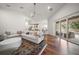 Spacious living room featuring hardwood floors and sliding glass doors to the patio at 307 Palmetto Ln, Largo, FL 33770