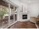 Living room featuring a fireplace and sliding glass doors to the backyard patio at 307 Palmetto Ln, Largo, FL 33770