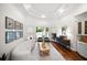 Bright living room with a modern sofa, large windows, and access to the outdoor area at 307 Palmetto Ln, Largo, FL 33770