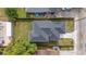 Aerial of roof and backyard featuring a well-maintained lawn at 3105 E Osborne Ave, Tampa, FL 33610