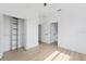 Spacious bedroom with a large closet, hardwood floors, and access to the bathroom at 3105 E Osborne Ave, Tampa, FL 33610