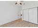 Another bedroom with a closet and wood-look flooring at 3105 E Osborne Ave, Tampa, FL 33610