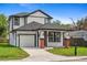 Charming two-story home with black trim, columns with brick bases, and a well-maintained lawn at 3105 E Osborne Ave, Tampa, FL 33610