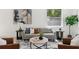 Cozy living room featuring a comfortable couch, stylish decor, and ample natural light at 3105 E Osborne Ave, Tampa, FL 33610