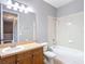 Bright bathroom featuring a vanity, toilet and tiled shower/tub combo at 3111 W De Leon St # 2, Tampa, FL 33609