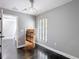 Bedroom featuring grey walls, dark floors, a window and a walk-in closet at 3111 W De Leon St # 2, Tampa, FL 33609