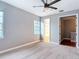 Bedroom featuring neutral walls and carpet, with two bright windows and an open doorway at 3111 W De Leon St # 2, Tampa, FL 33609