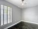 Light-filled bedroom featuring gray walls, dark floors and natural light from the window at 3111 W De Leon St # 2, Tampa, FL 33609