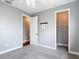 Bedroom with a ceiling fan, walk-in closet, and gray walls at 3111 W De Leon St # 2, Tampa, FL 33609