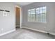 Bedroom featuring grey walls, carpet, and a window with a view at 3111 W De Leon St # 2, Tampa, FL 33609