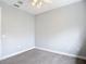 Bright bedroom featuring neutral walls and carpet, with a modern ceiling fan at 3111 W De Leon St # 2, Tampa, FL 33609