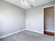 Bedroom featuring neutral carpet, a ceiling fan, and a doorway at 3111 W De Leon St # 2, Tampa, FL 33609