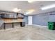 Spacious garage with workbench and custom cabinets for storage and organization at 3111 W De Leon St # 2, Tampa, FL 33609