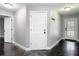 Hallway with a decorative finish concrete floor, doors, and coat hooks at 3111 W De Leon St # 2, Tampa, FL 33609