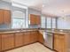 The kitchen showcases stone countertops, stainless steel appliances, and tile flooring at 3111 W De Leon St # 2, Tampa, FL 33609