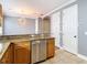 Open kitchen area featuring granite countertops and a modern stainless steel dishwasher at 3111 W De Leon St # 2, Tampa, FL 33609