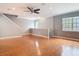 Sunlit living room featuring wood floors, neutral walls, and a ceiling fan at 3111 W De Leon St # 2, Tampa, FL 33609