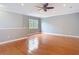 Open-concept living room with hardwood floors and neutral paint at 3111 W De Leon St # 2, Tampa, FL 33609