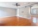 Spacious living room featuring hardwood floors, crown molding, and neutral paint at 3111 W De Leon St # 2, Tampa, FL 33609