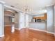 Open-concept living room features hardwood floors, crown molding, and sightlines to kitchen at 3111 W De Leon St # 2, Tampa, FL 33609