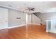 Spacious living room featuring hardwood floors, crown molding, and staircase at 3111 W De Leon St # 2, Tampa, FL 33609
