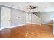 Open-concept living room features hardwood floors, crown molding, and staircase at 3111 W De Leon St # 2, Tampa, FL 33609