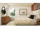 Well-lit bedroom featuring a comfortable bed, modern decor, and a relaxing atmosphere at 32066 Griffin Sands Ln, San Antonio, FL 33576