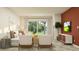 Cozy living area with stylish seating, entertainment center, and views of the outdoors at 32066 Griffin Sands Ln, San Antonio, FL 33576