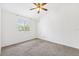 Bedroom featuring neutral walls, carpeted floors, a ceiling fan, and a window at 3209 Meta Ct, Largo, FL 33771