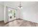 Cozy dining room with natural light beaming in from the glass patio doors at 3209 Meta Ct, Largo, FL 33771