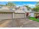 Charming townhome showcasing a well-maintained exterior with an attached garage and landscaped front yard at 3209 Meta Ct, Largo, FL 33771