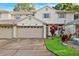 Charming townhome showcasing a well-maintained exterior with an attached garage and landscaped front yard at 3209 Meta Ct, Largo, FL 33771