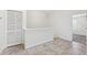 Bright hallway area featuring neutral paint and tile flooring, plus closet space at 3209 Meta Ct, Largo, FL 33771