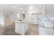 Bright kitchen features stainless appliances, center island, and modern countertops at 3209 Meta Ct, Largo, FL 33771